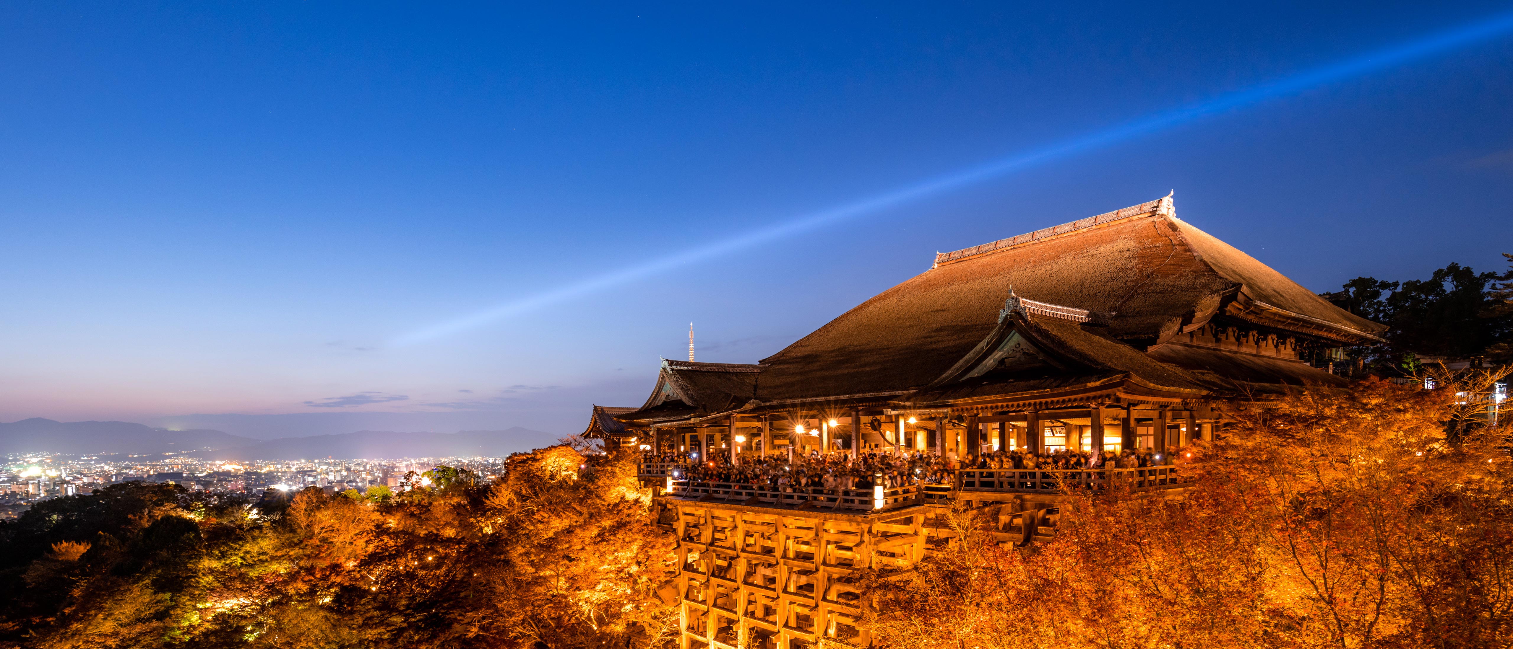 The stage of Kiyomizu-dera and autumn leaves glowing in the sunset